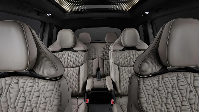 Wide shot looking back at the Q9's three rows of gray leather seats