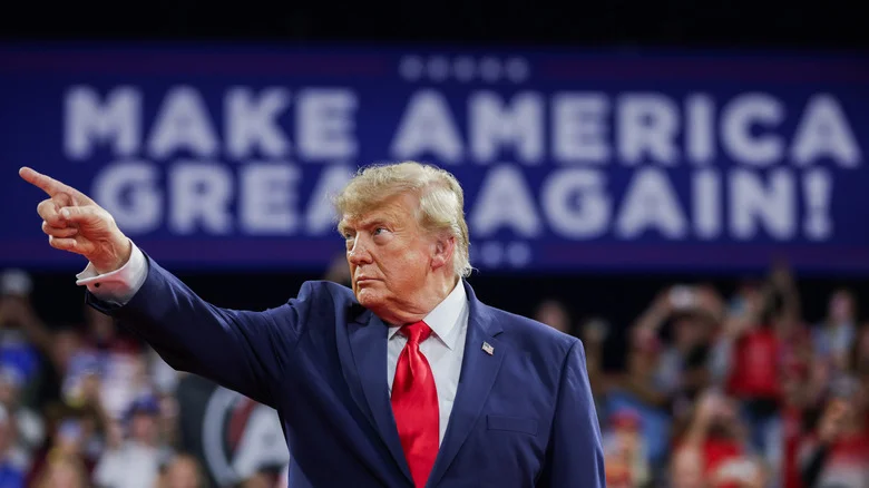 FORT MYERS, FLORIDA - OCTOBER 23: U.S. President Donald Trump gestures to the crowd as he arrives to an election rally at Alico Arena on the Florida Gulf Coast University campus on October 23, 2026 in Fort Myers, Florida. President Trump traveled to Florida to rally for local Republican candidates ahead of next week's midterm elections. (Photo by Alex Wong/Getty Images)