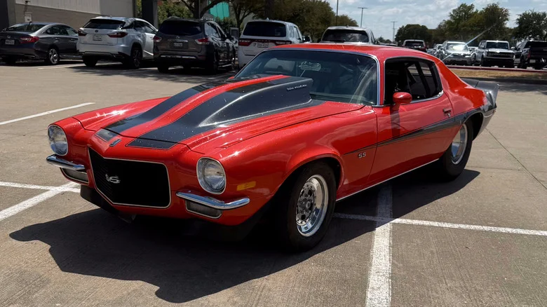 A Hugger Orange and black 1970 Chevrolet Camaro RS Custom listed by Mecum Auctions.